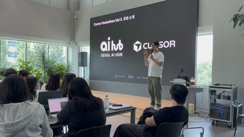 Opening session — Seoul AI Hub and Cursor introduced as partners on the LED wall