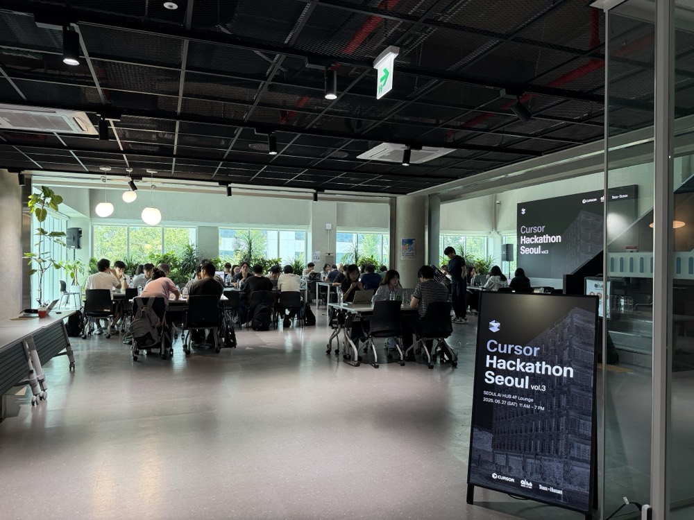 The 4F lounge in full swing, event signage at the entrance
