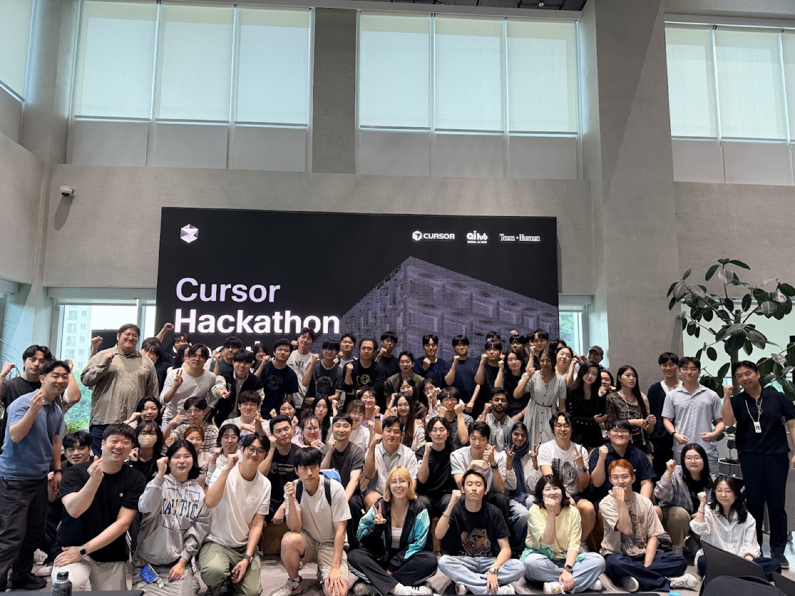 Team Human group photo in front of the Cursor Hackathon Seoul vol.3 LED wall at Seoul AI Hub